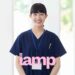 Nurse in blue scrub uniform smiling